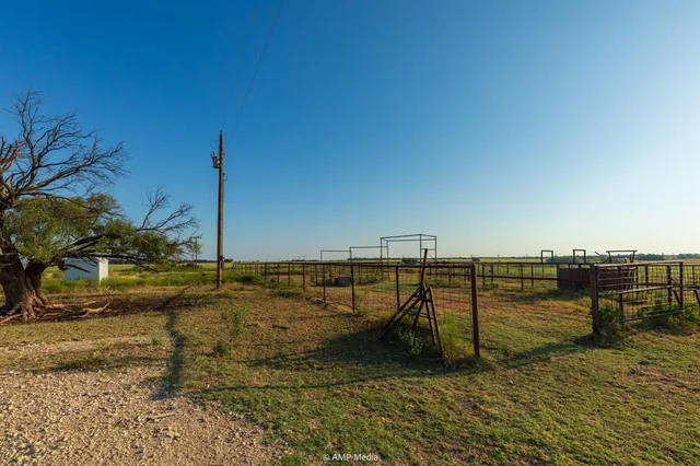 a view of water with boats and trees in the background