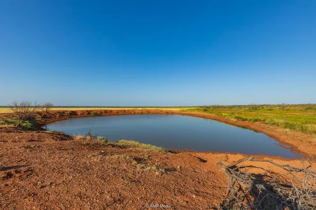 a view of beach and swimming pool