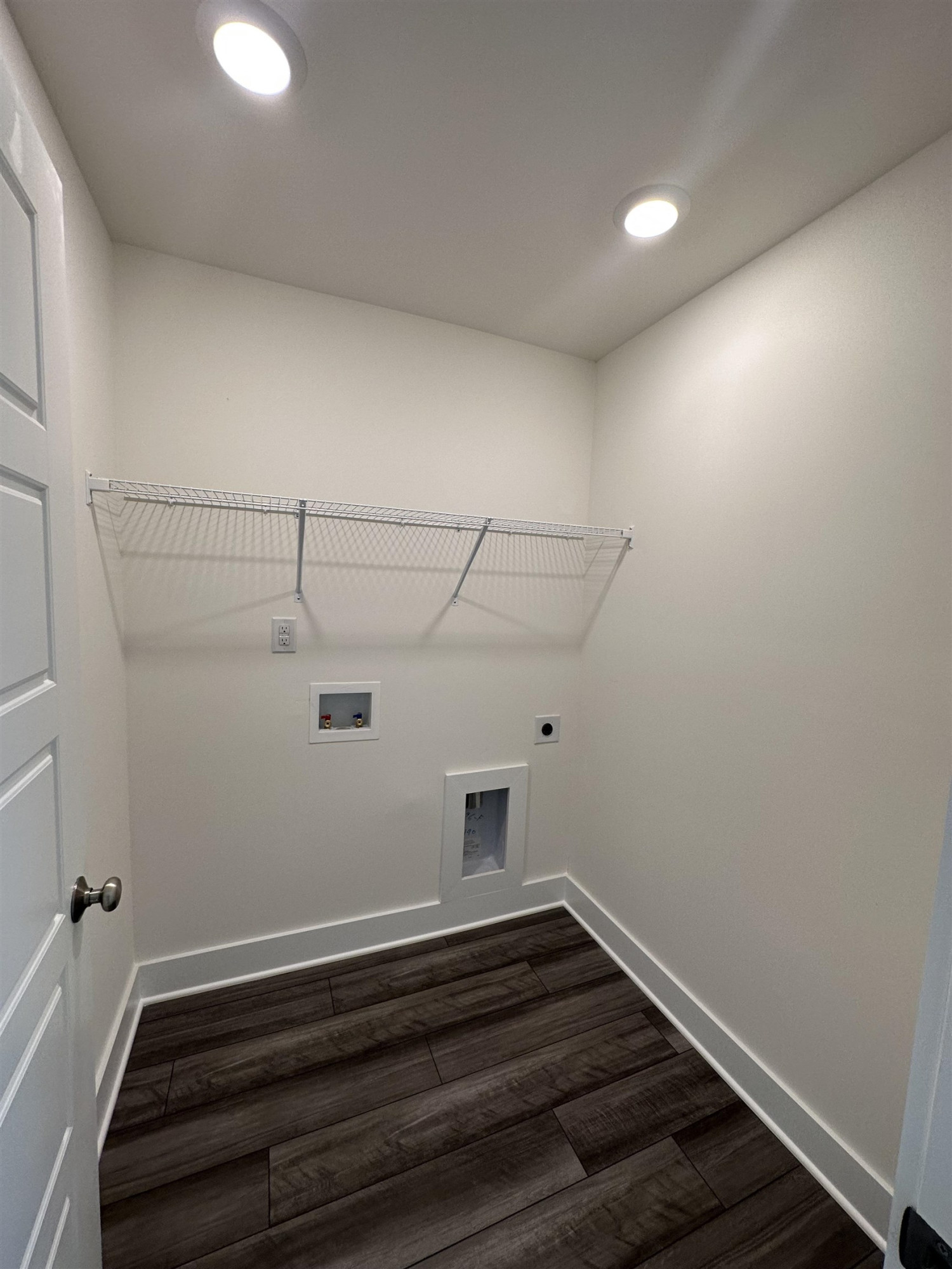4500 Beckel Road Willow Spring, NC 27592 - Photo 17 of 27 a view of a room with racks on the wall