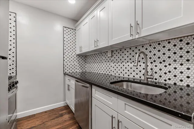 a kitchen with granite countertop a sink and a granite counter tops