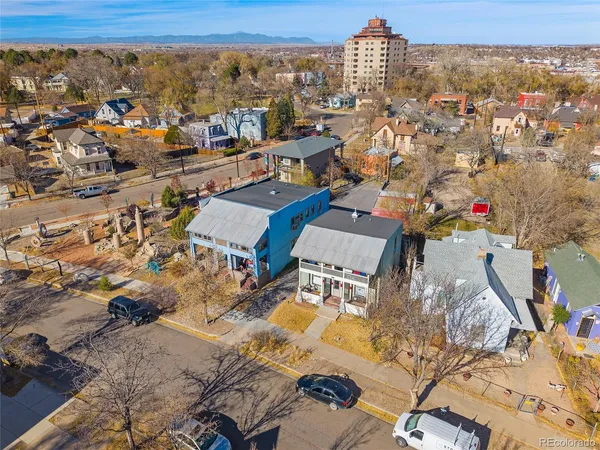 a view of a livingroom with wooden floor and a fireplace