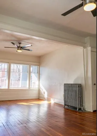 a kitchen with stainless steel appliances granite countertop white cabinets and sink