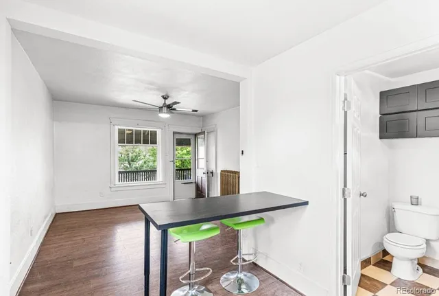 a view of kitchen with furniture and wooden floor