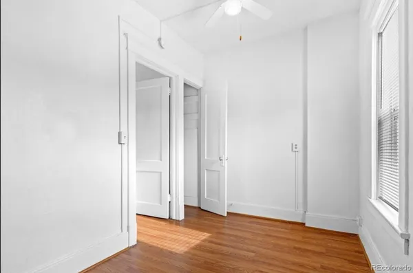 a kitchen with a sink a stove and a refrigerator