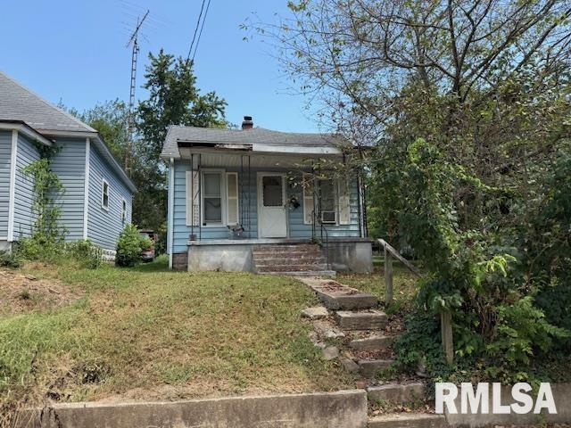 524 South 17th Street Murphysboro, IL 62966 - Photo 1 of 13 a view of a white house with large windows and a tree