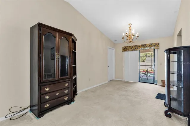 a view of a livingroom with furniture and closet