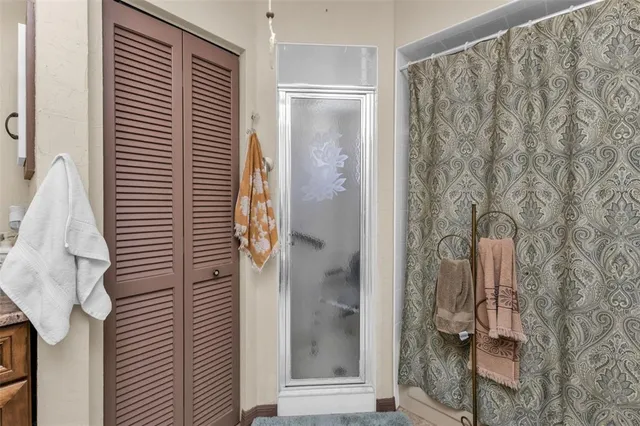 a bathroom with a sink mirror and toilet