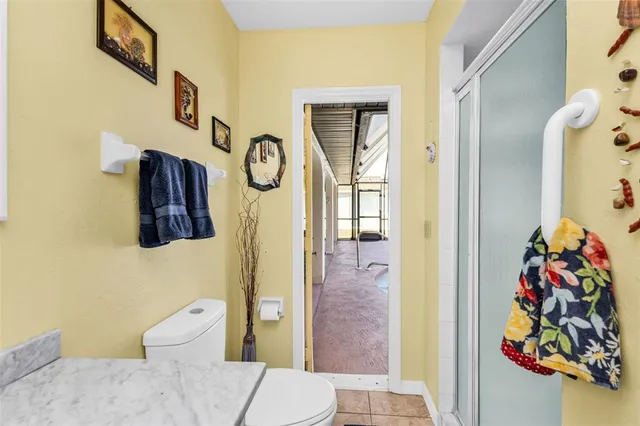 a view of a livingroom with furniture and a table