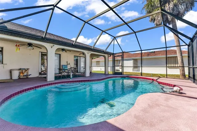 a view of a house with backyard and porch