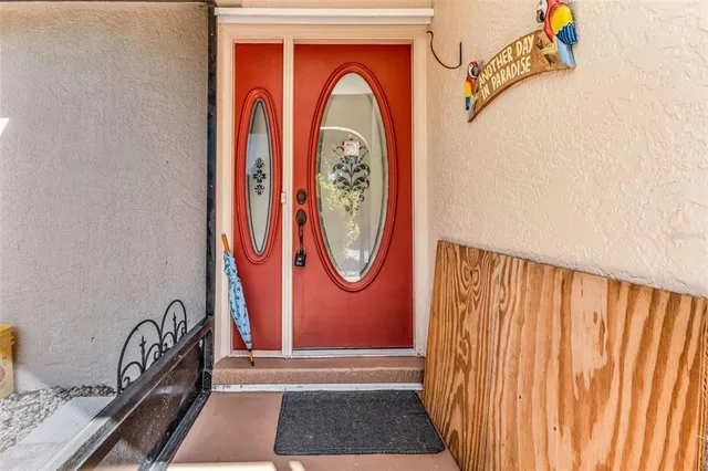 a view of front door with wooden floor