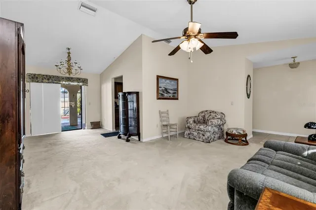 a view of a livingroom with furniture and a chandelier