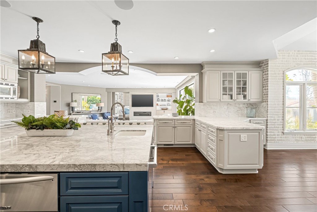 1240 5th Street Manhattan Beach, CA 90266 - Photo 14 of 68 a view of living room with granite countertop furniture and wooden floor