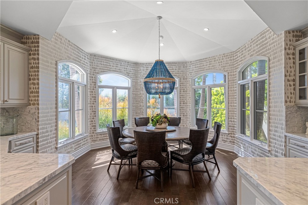 1240 5th Street Manhattan Beach, CA 90266 - Photo 16 of 68 a view of a dining room with furniture wooden floor and chandelier