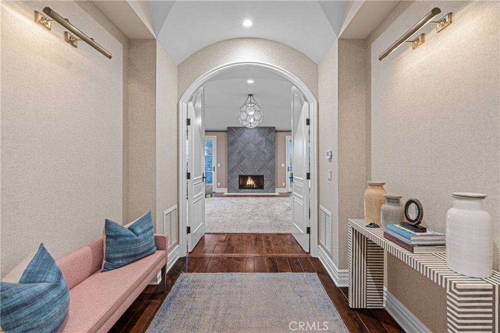 1240 5th Street Manhattan Beach, CA 90266 - Photo 29 of 68 a view of a hallway with wooden floor and living room