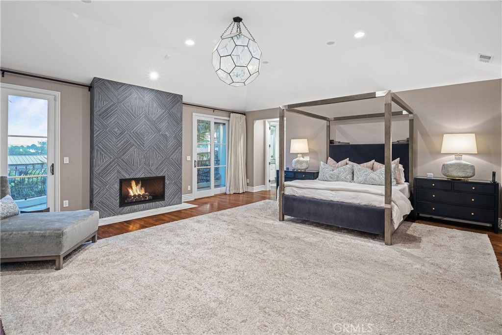 1240 5th Street Manhattan Beach, CA 90266 - Photo 31 of 68 a bedroom with a bed and a fireplace