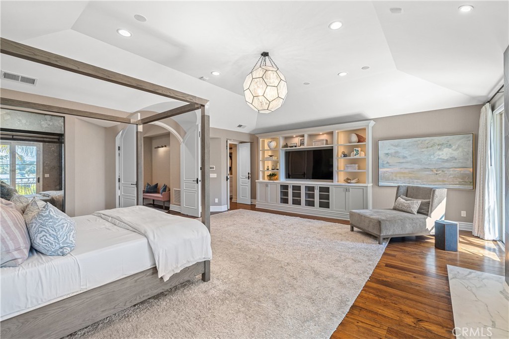 1240 5th Street Manhattan Beach, CA 90266 - Photo 33 of 68 a spacious bedroom with a large bed and a flat screen tv
