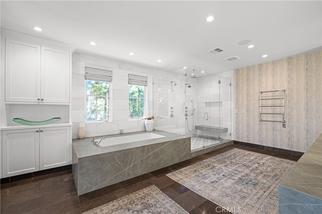 1240 5th Street Manhattan Beach, CA 90266 - Photo 38 of 68 a bathroom with a tub a sink and a window
