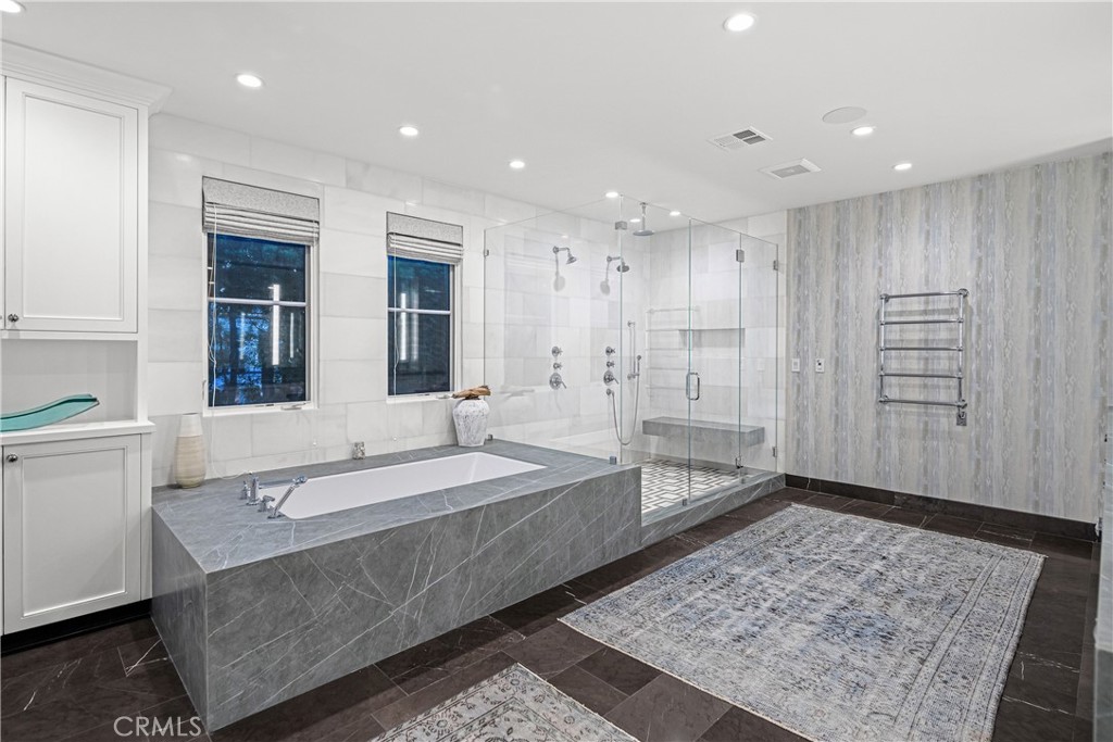 1240 5th Street Manhattan Beach, CA 90266 - Photo 39 of 68 a spacious bathroom with a shower and a bath tub