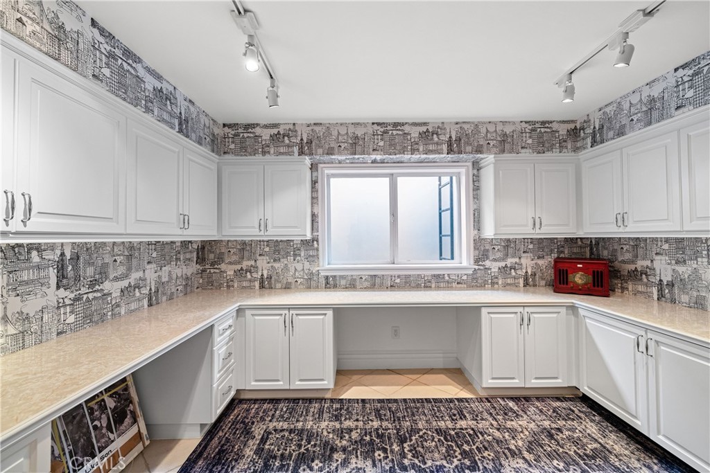 1240 5th Street Manhattan Beach, CA 90266 - Photo 59 of 68 a kitchen with a sink stove and cabinets