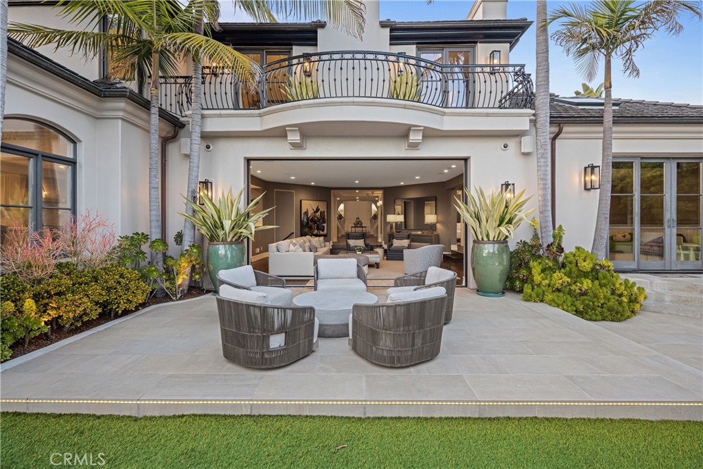1240 5th Street Manhattan Beach, CA 90266 - Photo 61 of 68 a view of a house with potted plants and a fountain