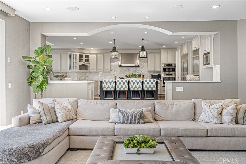 1240 5th Street Manhattan Beach, CA 90266 - Photo 8 of 68 a living room with furniture kitchen and a potted plant