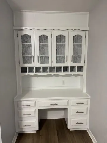 a view of an empty room with cabinet