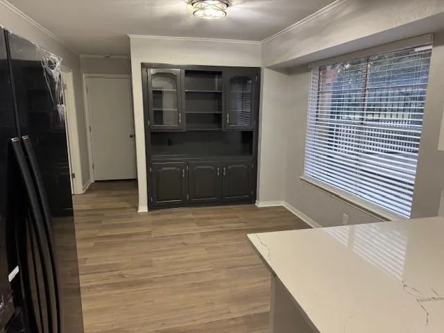 a room with a refrigerator and a sink