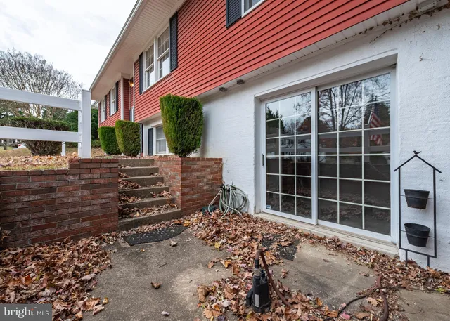 front view of a house with a large window