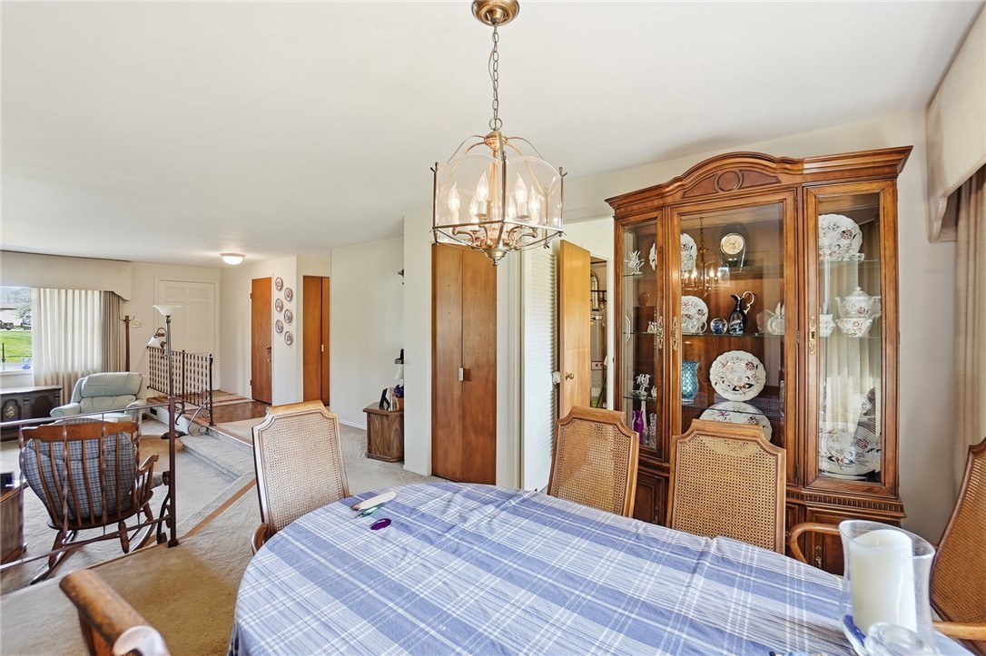 6225 Possum Run Road Bellbrook, OH 45305 - Photo 7 of 33 This inviting dining room with a classic chandelier provides a perfect setting for intimate gatherings.