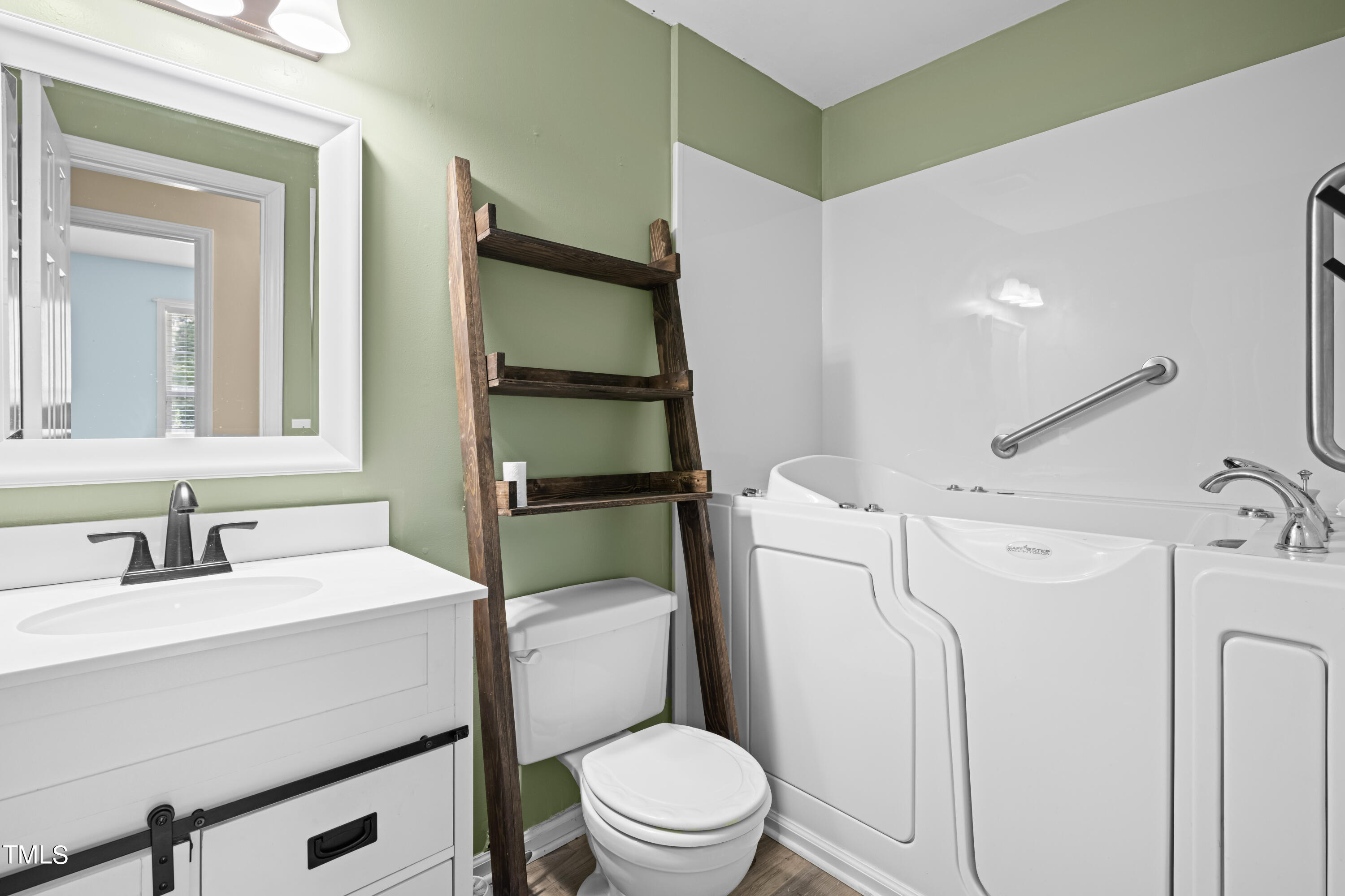320 Amber Lane Willow Spring, NC 27592 - Photo 12 of 16 a bathroom with a sink toilet vanity and tub