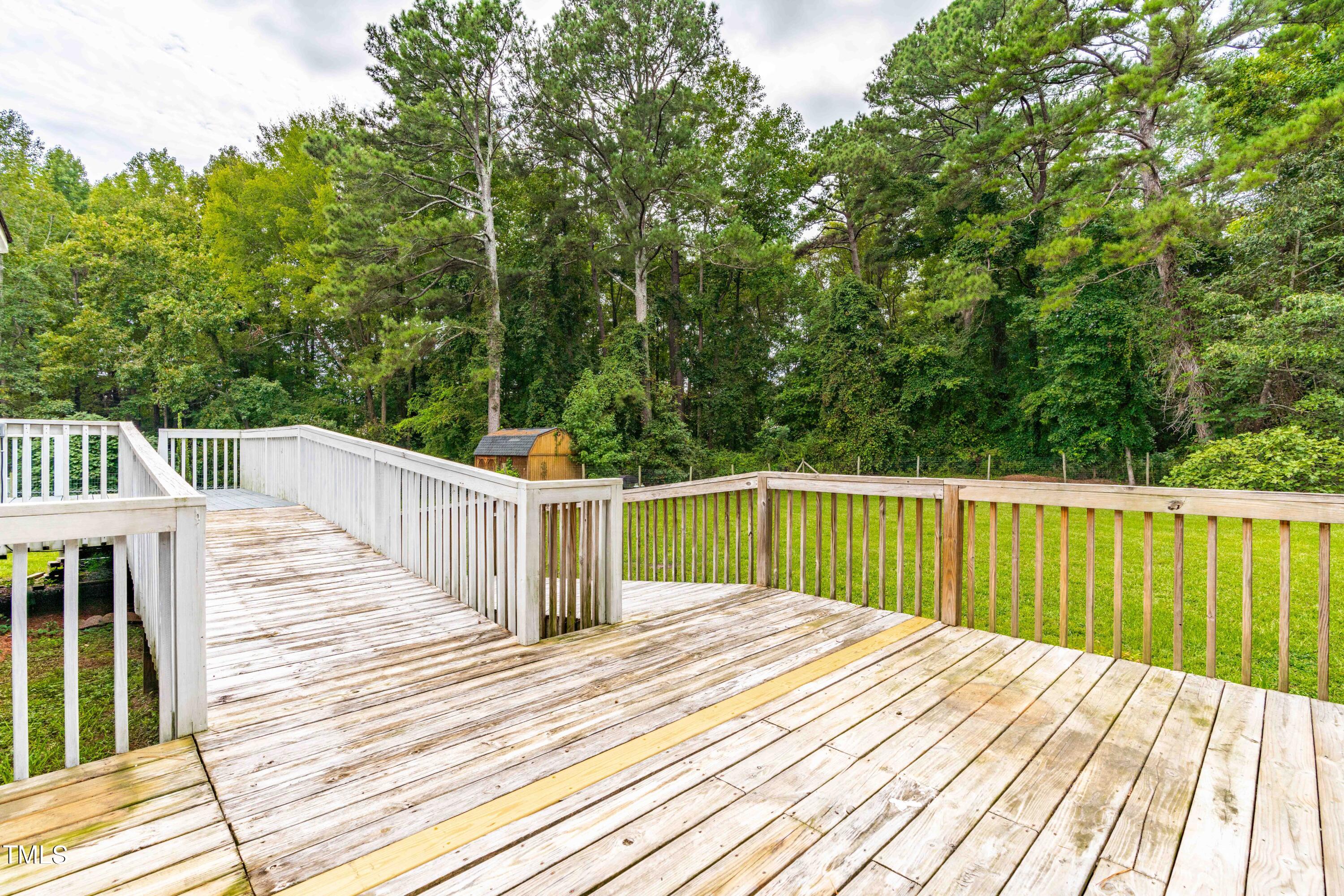 320 Amber Lane Willow Spring, NC 27592 - Photo 14 of 16 a view of balcony and wooden floor