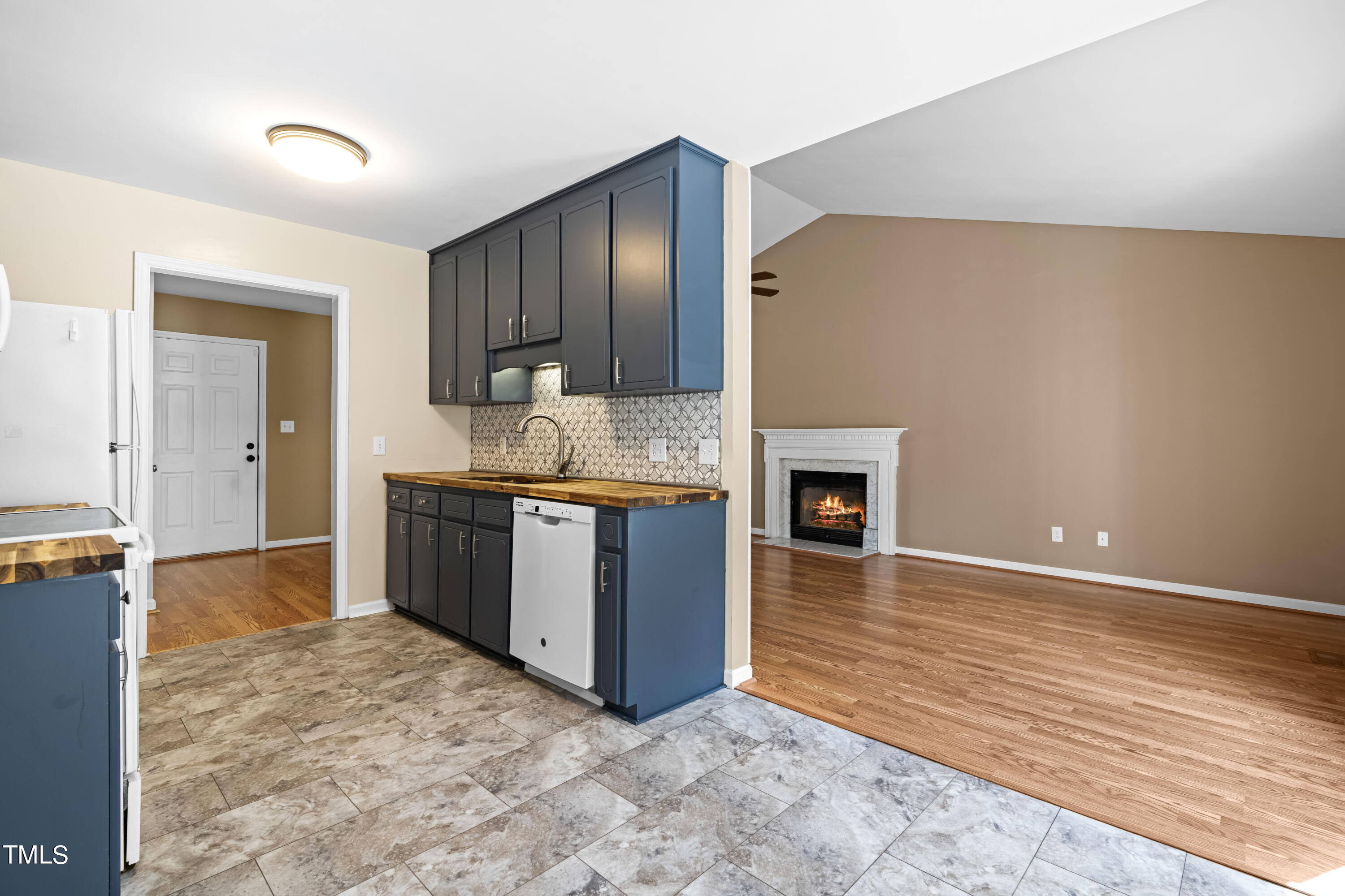 320 Amber Lane Willow Spring, NC 27592 - Photo 4 of 16 a spacious bathroom with a granite countertop sink and a mirror