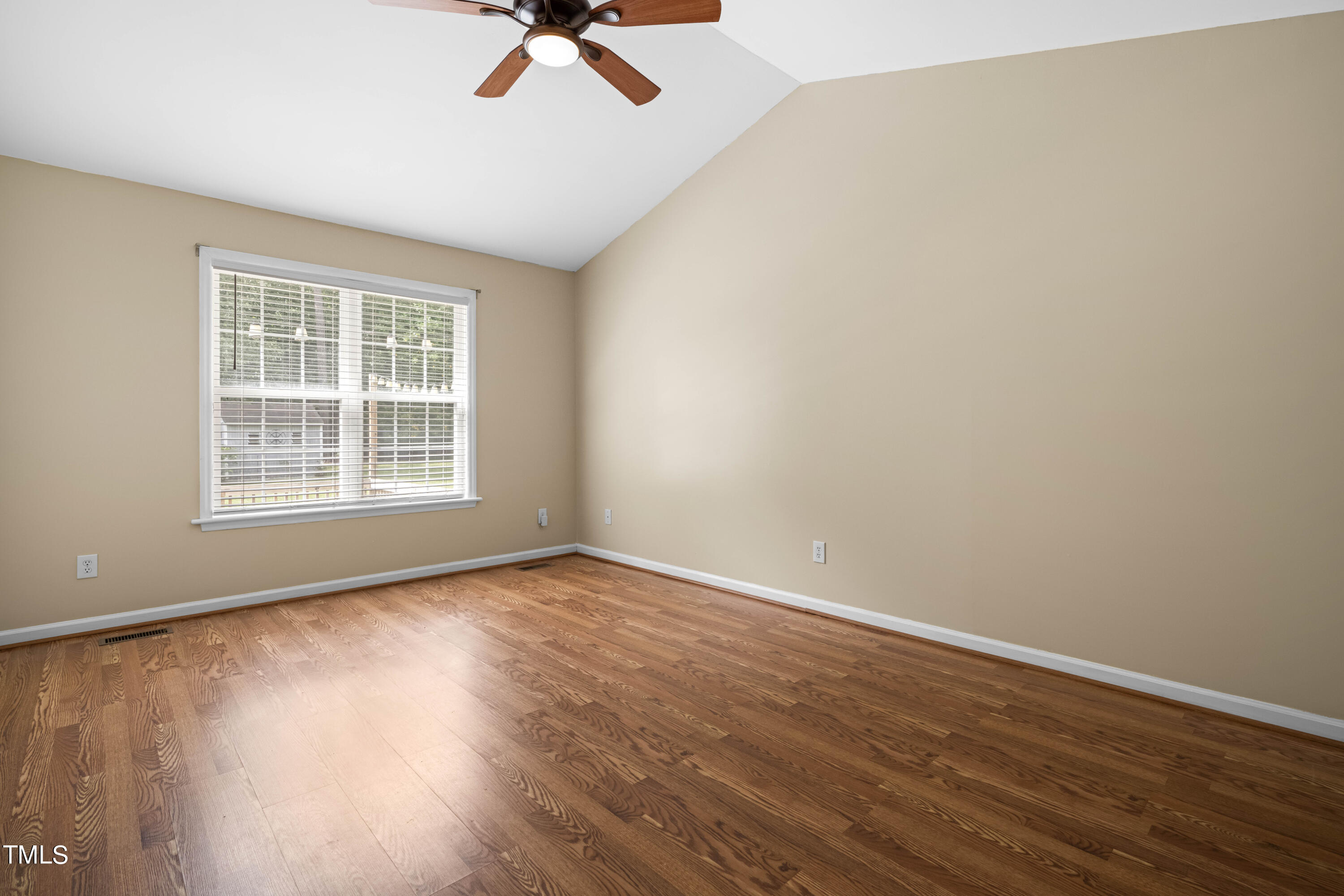 320 Amber Lane Willow Spring, NC 27592 - Photo 8 of 16 wooden floor in an empty room with a window