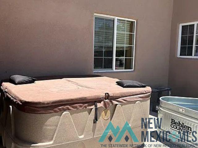 32 Hickey Road Pie Town, NM 87827 - Photo 36 of 39 View of patio / terrace featuring a hot tub