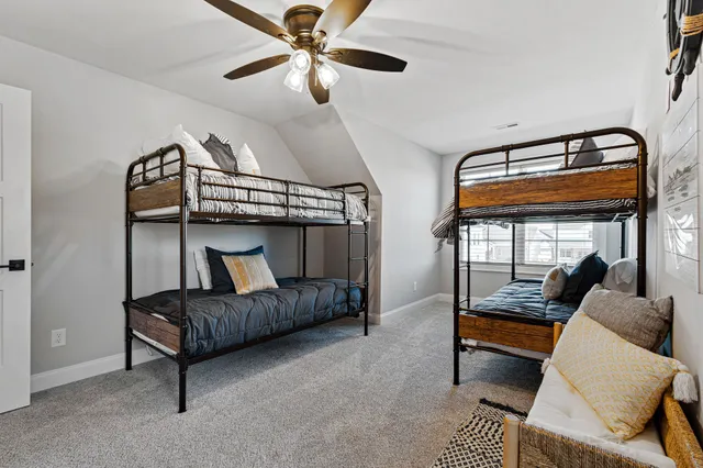 a bedroom with furniture and a window