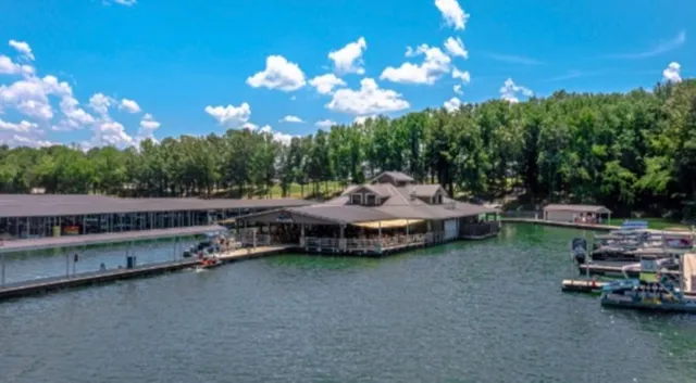 a view of a patio with swimming pool and furniture