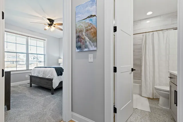 a spacious bedroom with a bed and a couch