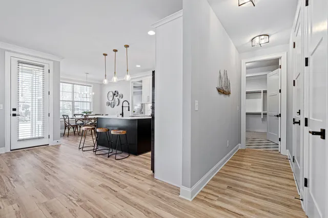 a view of a kitchen from the hallway