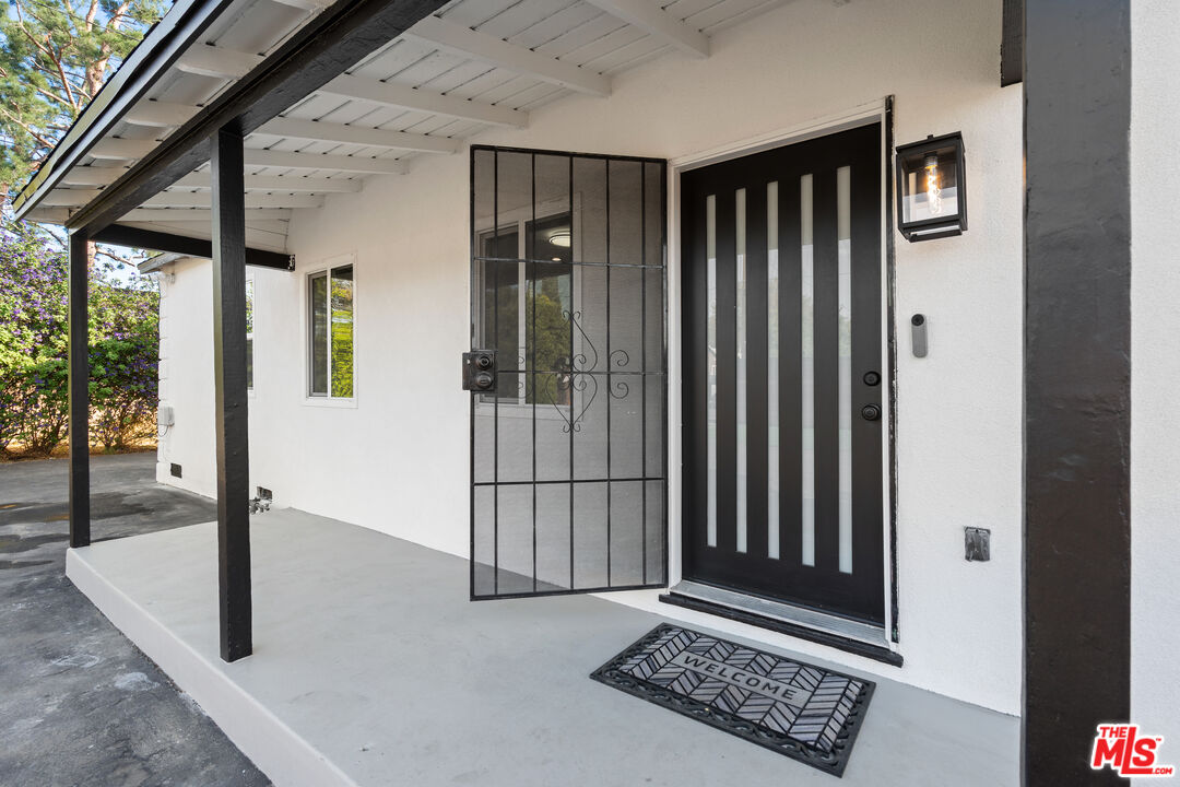 20850 Chase Street Winnetka, CA 91306 - Photo 3 of 25 a view of a entryway door of the house