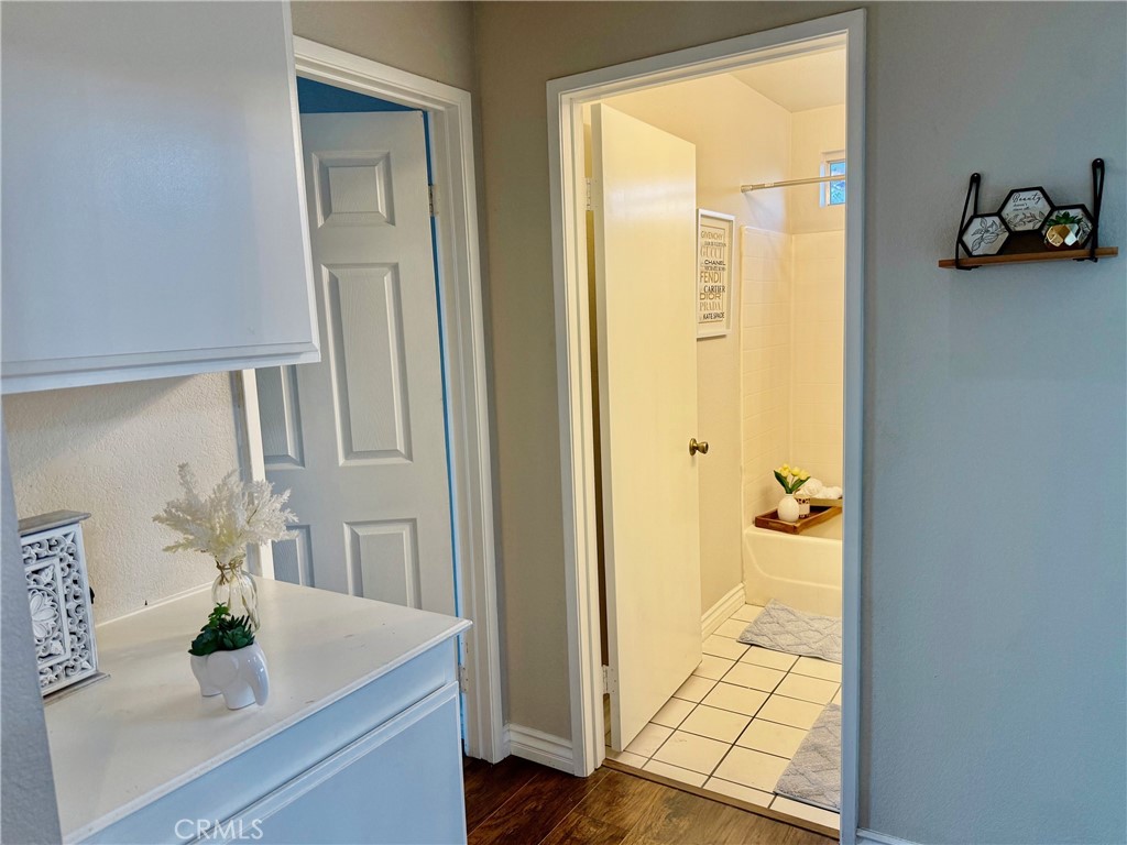 12966 Sundown Road Victorville, CA 92392 - Photo 14 of 20 a bathroom with a tub shower and a sink