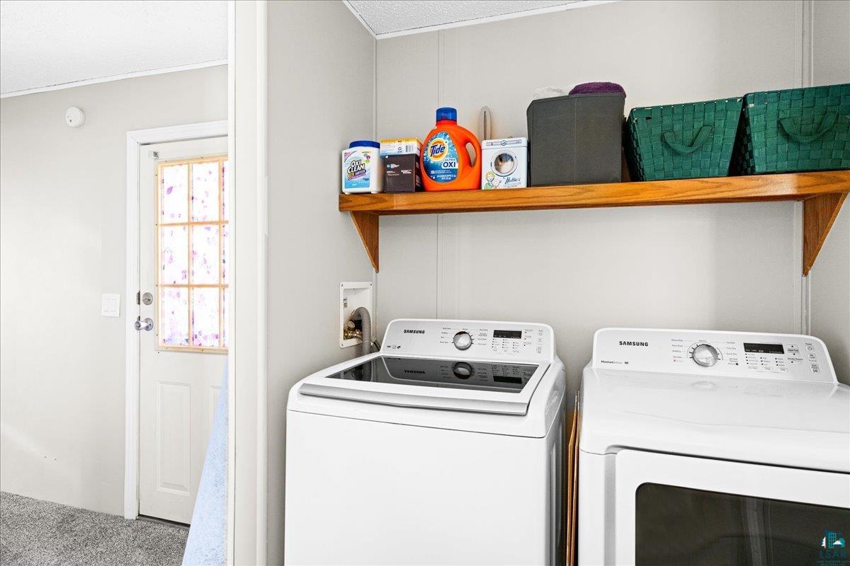 30 Ivy Drive Duluth, MN 55810 - Photo 11 of 21 Clothes washing area with carpet, washer and dryer, and a textured ceiling