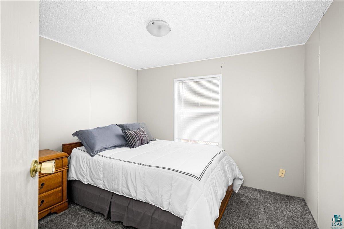 30 Ivy Drive Duluth, MN 55810 - Photo 9 of 21 Carpeted bedroom featuring a textured ceiling