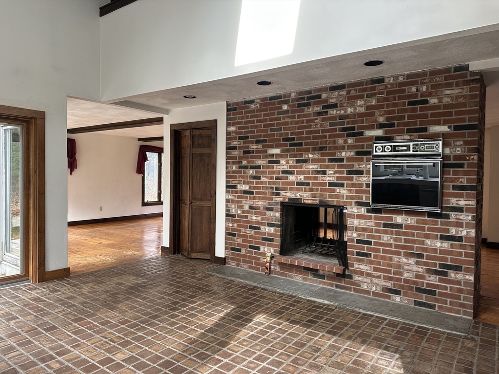 332 Old Littleton Road Harvard, MA 01451 - Photo 14 of 31 a living room with fireplace furniture and a fireplace