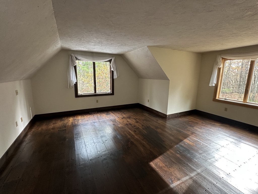 332 Old Littleton Road Harvard, MA 01451 - Photo 16 of 31 a view of an empty room with wooden floor and a window