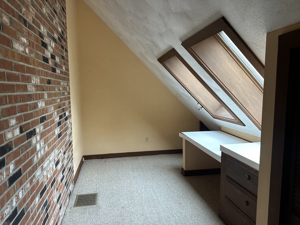 332 Old Littleton Road Harvard, MA 01451 - Photo 17 of 31 a view of an empty room and wooden floor