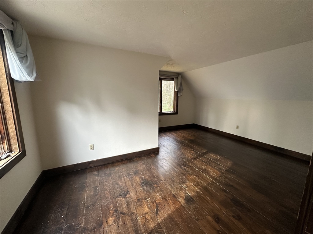 332 Old Littleton Road Harvard, MA 01451 - Photo 18 of 31 an empty room with wooden floor and windows