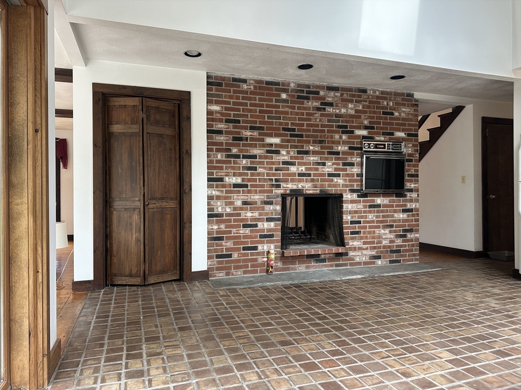 332 Old Littleton Road Harvard, MA 01451 - Photo 20 of 31 a view of fireplace and window in the room