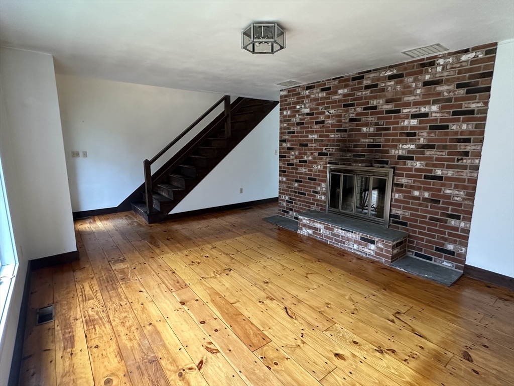 332 Old Littleton Road Harvard, MA 01451 - Photo 21 of 31 a living room with a fireplace