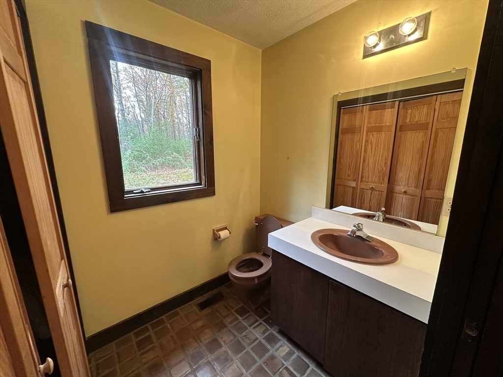 332 Old Littleton Road Harvard, MA 01451 - Photo 22 of 31 a bathroom with a sink and a toilet