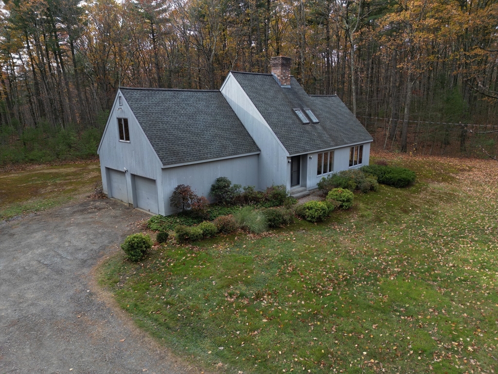332 Old Littleton Road Harvard, MA 01451 - Photo 29 of 31 a aerial view of a house next to a big yard and large trees